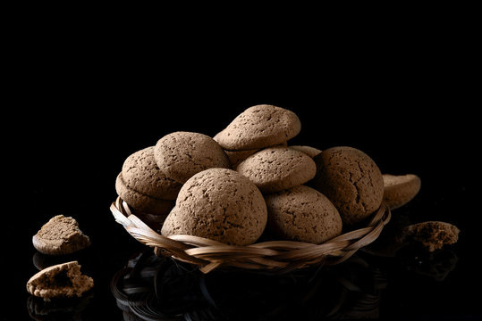 Oatmeal cookies on a black background.