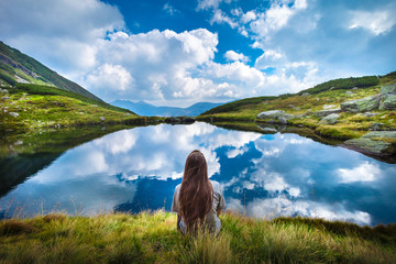 Girl admiring lake landscape view