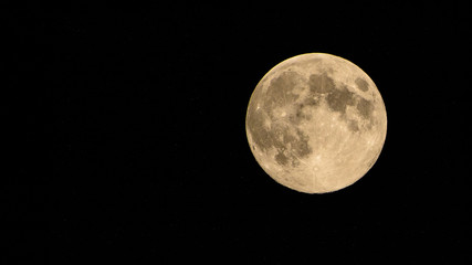 Full moon with stars during a clear sky night.