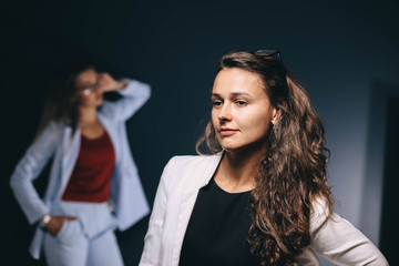 two young women business colleagues in a studio office.