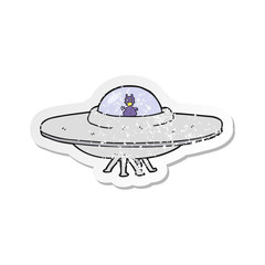 retro distressed sticker of a cartoon UFO