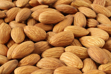 A heap of raw almonds. Closeup. Macro