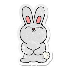 distressed sticker of a quirky hand drawn cartoon rabbit