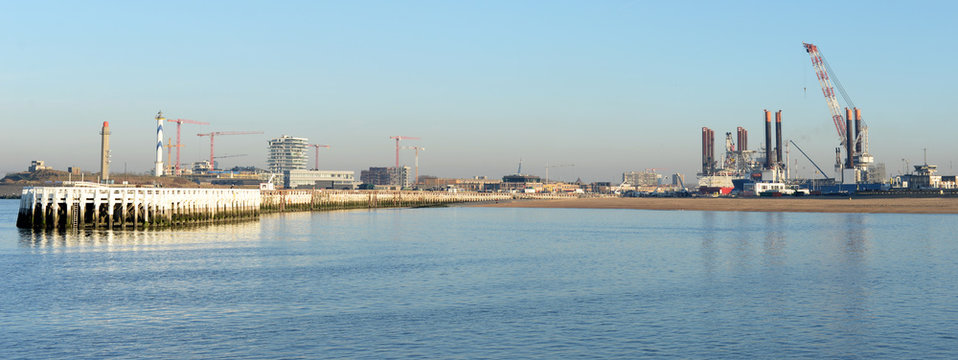 Panoramic view on port and eastern pier in Ostend, Belgium on a sunny winter evening