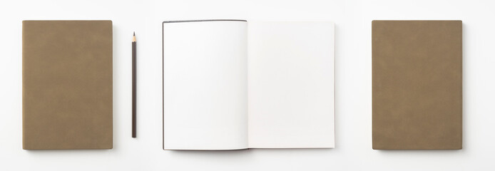 brown notebook and pen on white background