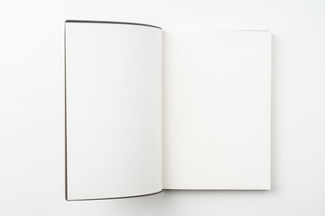 opened brown notebook on white background