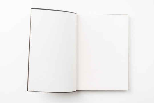 opened red notebook on white background