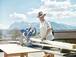 Carpenter working, circular saw