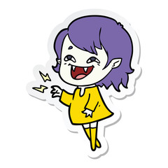 sticker of a cartoon laughing vampire girl