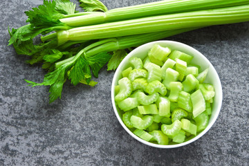Chopped celery stalks in a bowl. Product for diet and proper nutrition.