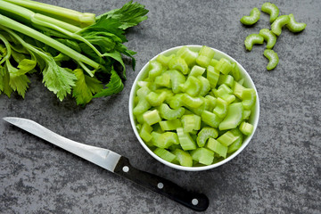 Chopped celery stalks in a bowl. Product for diet and proper nutrition.