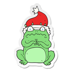 sticker of a cartoon frog in christmas hat