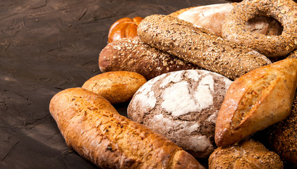Assortment of baked goods on dark background