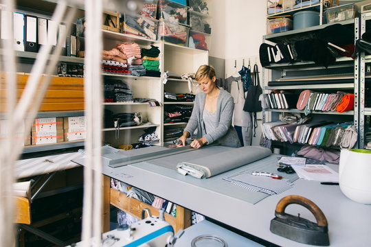 Fashion designer working on template in studio