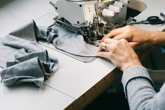 Close-up of woman using sewing machine