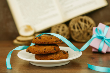 Chocolate cookies in a plate on a wooden table