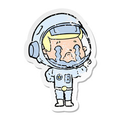 distressed sticker of a cartoon crying astronaut