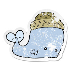 distressed sticker of a cartoon whale wearing hat