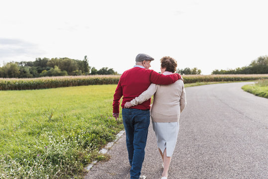 Senior couple on a walk in rural landscape