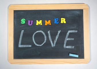 Fototapeta na wymiar Summer love message on chalkboard