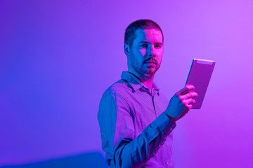 Artistic portrait of a businessman in vivid light