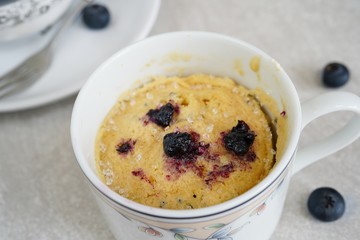 Homemade blueberry mug cake muffin, selective focus