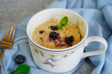 Homemade blueberry mug cake muffin, selective focus