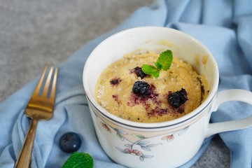 Homemade blueberry mug cake muffin, selective focus