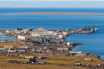 Fototapeta na wymiar Pevek is the northernmost city in Russia. Summer view of the town, power plant and sea port. Chukotka, Siberia, Russian Far East. Arctic Ocean.