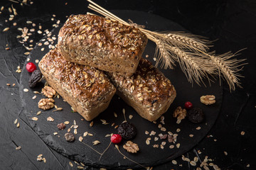 Freshly baked delicious bread with dried fruits and nuts. Homebaked. Useful, tasty, nutritious.