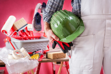 Professional house painter at work on the construction site. Building. © francescomou