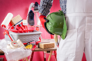 Professional house painter at work on the construction site. Building. © francescomou