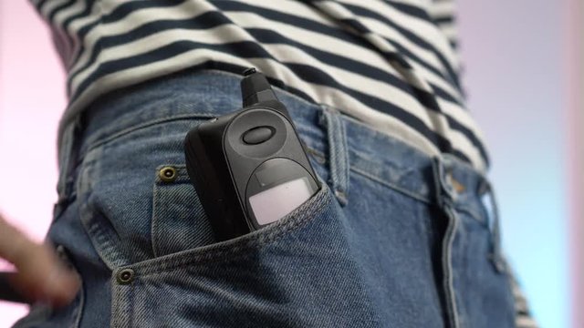 80s 90s cell phone being used by a young adult.