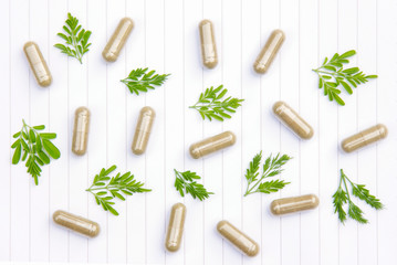 Fototapeta na wymiar Herbal powder medicine in capsules for healthy eating 