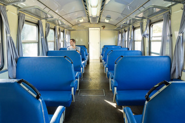 Retro railroad car with one passenger
