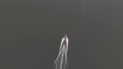 Aerial 4k footage Top view of fisherman boat on moving towards at sea.