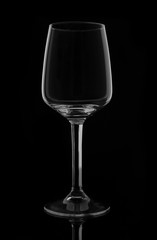 A glass for dessert and fortified wine. On a dark background. Circuit.