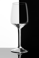A glass for dessert and fortified wine. On a black and white background.