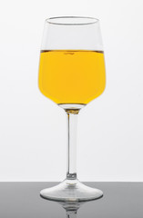 A glass for dessert and fortified wine. On a light background. Isolated.