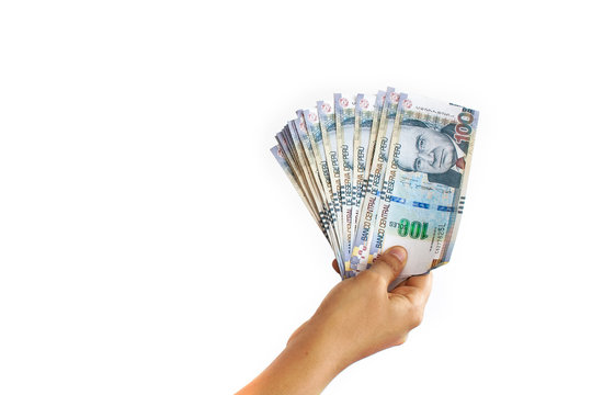 Close Up Of A Hand Holding 100 Peruvian Soles Bills In A Fan Shape On White Background