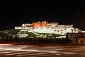Night scene of the Potala Palace from the Potala Palace Square  in the front,  Lhasa, Tibet, China....