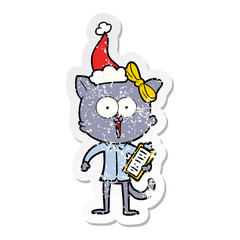 distressed sticker cartoon of a cat wearing santa hat