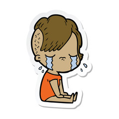 sticker of a cartoon crying girl
