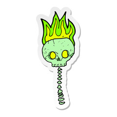 sticker of a cartoon spooky skull and spine