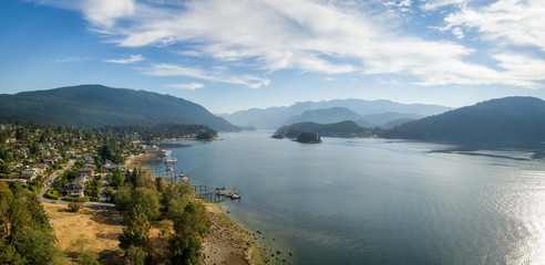 Aerial Panoramic view of a beautiful Ocean Inlet in the Modern City during a sunny summer day. Taken in Deep Cove, North Vancouver, BC, Canada.