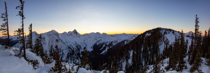 Beautiful panoramic Canadian Landscape View during a vibrant winter sunset. Taken on top of Zoa Peak near Hope, British Columbia, Canada.