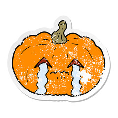 distressed sticker of a cartoon crying halloween pumpkin