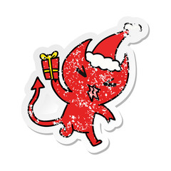 christmas distressed sticker cartoon of kawaii devil