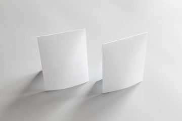 Blank portrait mock-up paper. brochure magazine isolated on gray, changeable background / white paper isolated on gray