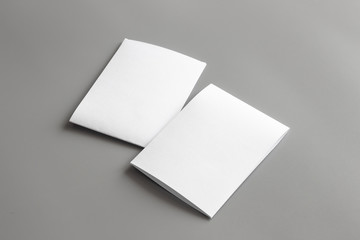 Blank portrait mock-up paper. brochure magazine isolated on gray, changeable background / white paper isolated on gray